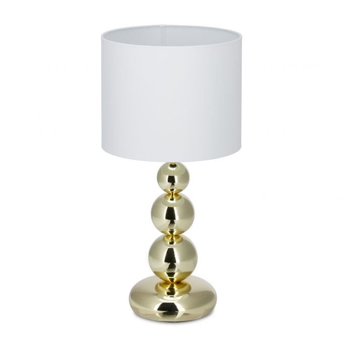 Złota lampa stołowa
