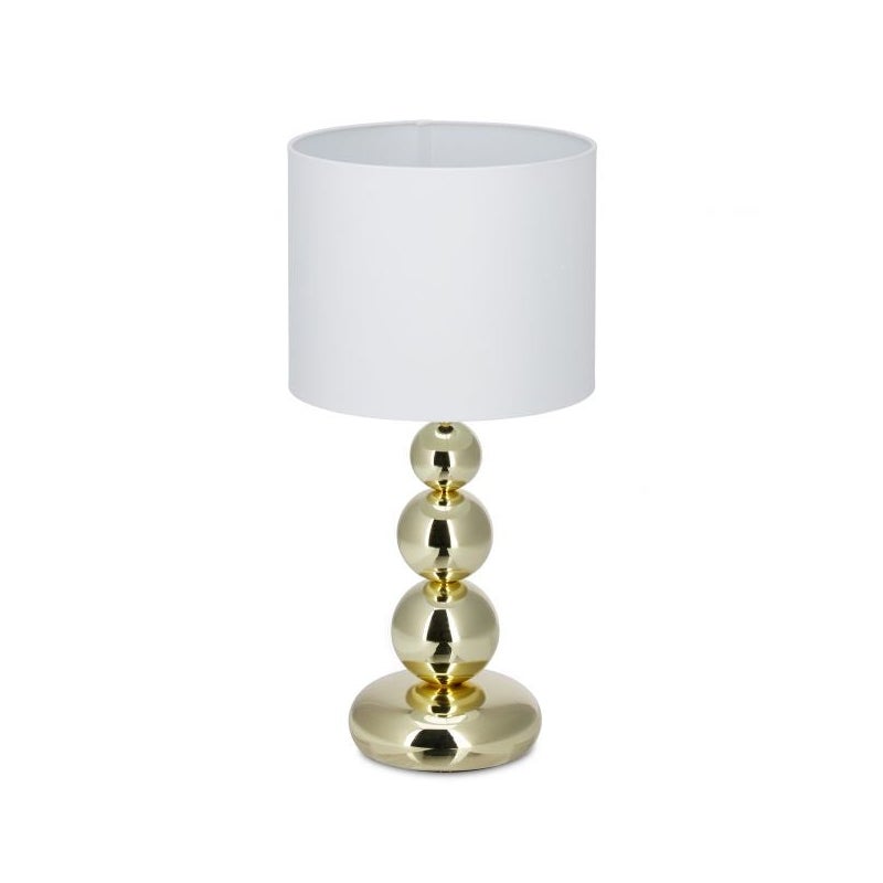 Złota lampa stołowa