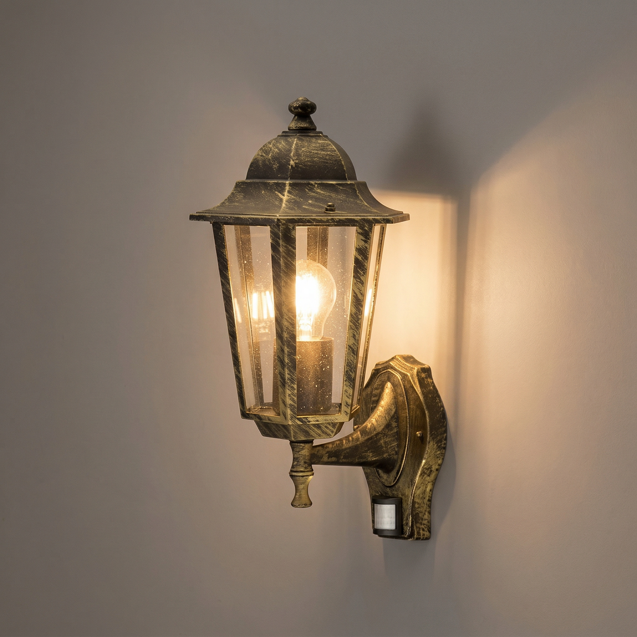 Kinkiet zewnętrzny z czujnikiem Velence złoty 1xE27x60W wym:36x21x23cm IP43 Rabalux