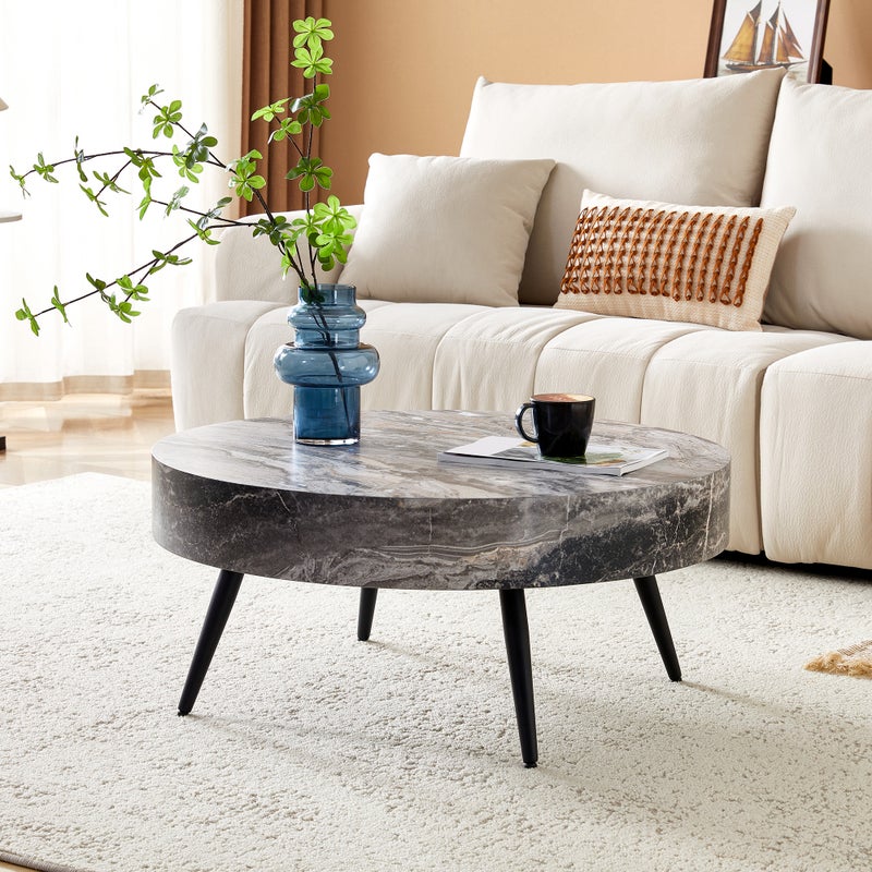 Okrągły stolik kawowy o średnicy 70 cm z szarego marmuru (MDF) i czarnych metalowych nóg. Minimalistyczny design idealny do salonów i małych