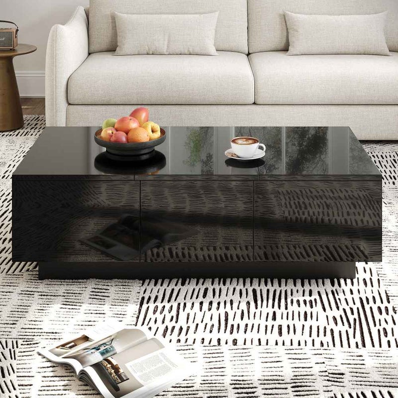 Nowoczesny, czarny lakierowany stolik kawowy z szufladami i wysuwanymi przegródkami, elegancki design, praktyczne miejsce do przechowywania
